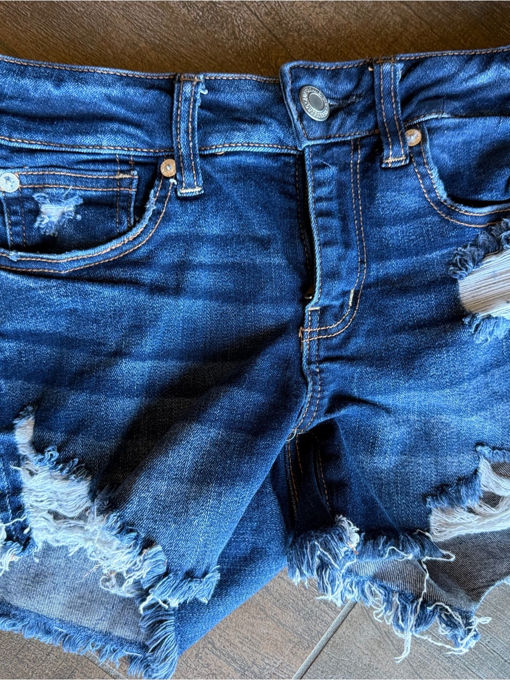 American Eagle Outfitters Dark Blue Distressed Denim Shorts. Tag says 4 - fits 0